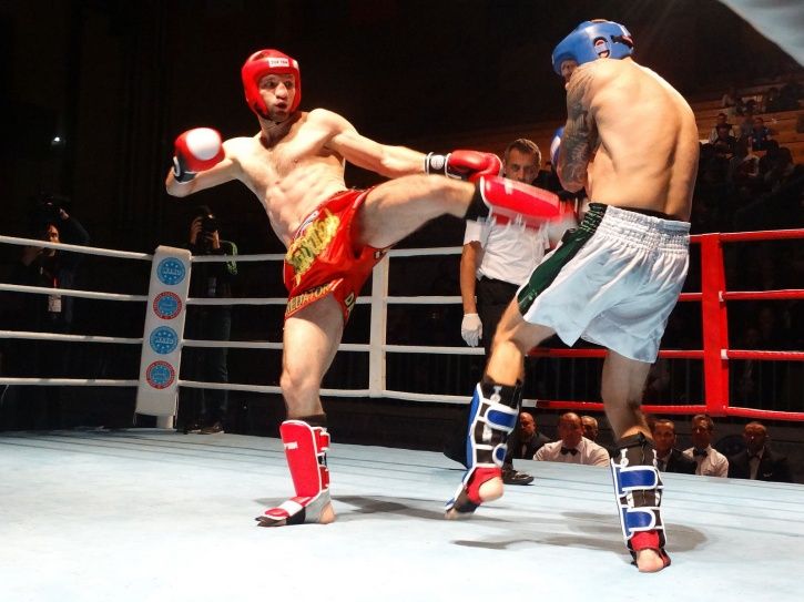 A kickboxer throwing a kick
